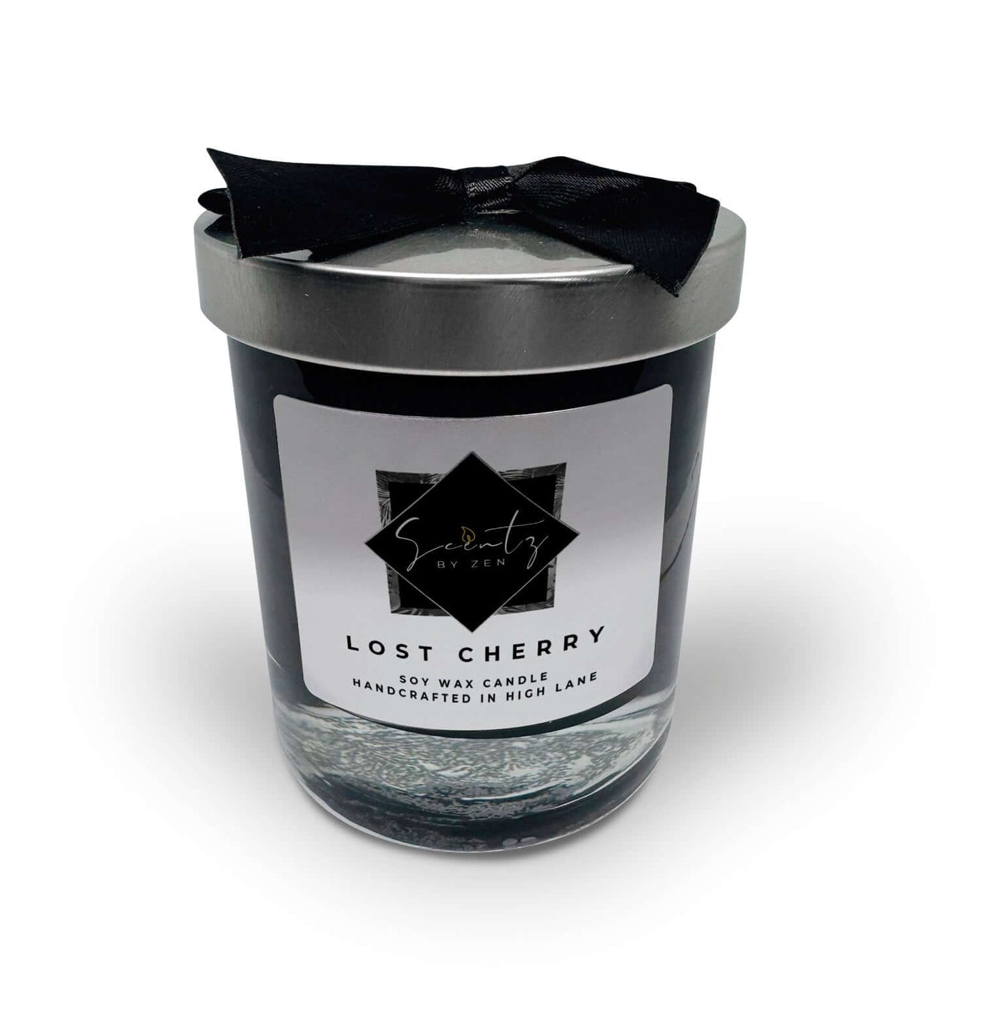7oz Black soy wax candle in a glass jar, labeled "Lost Cherry" topped with a silver lid and black ribbon, handcrafted in High Lane.