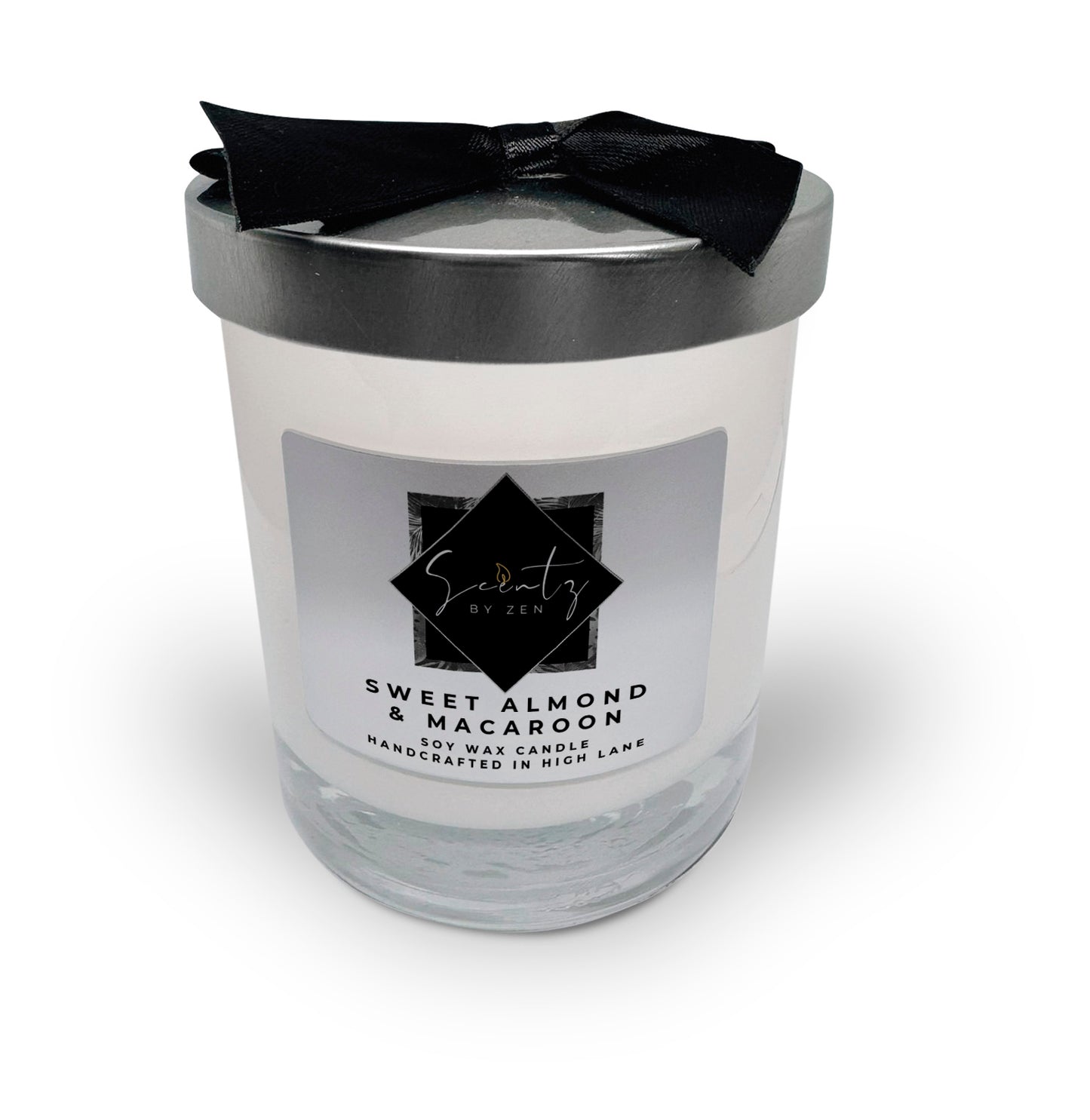 10oz White soy wax candle in a glass jar, labeled "Sweet Almond & Macaroon" topped with a silver lid and black ribbon, handcrafted in High Lane.