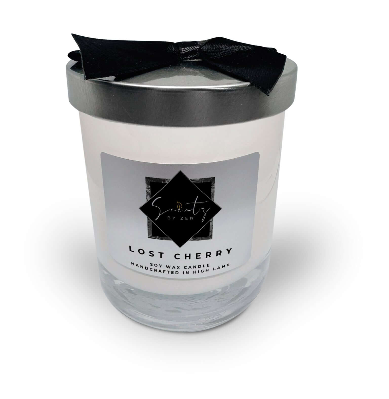10oz White soy wax candle in a glass jar, labeled "Lost Cherry" topped with a silver lid and black ribbon, handcrafted in High Lane.